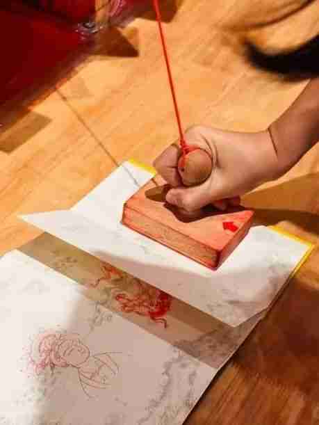 A child's stamp book filled with Dunhuang seal impressions
