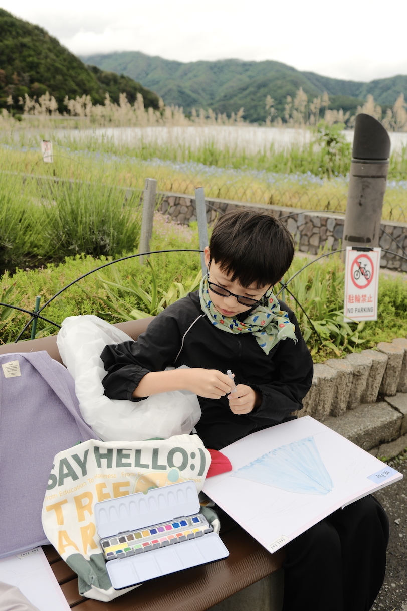 A child's watercolour painting of the Mount Fuji landscape