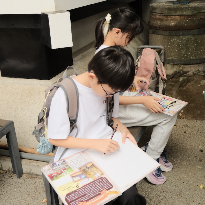 Children pausing on the Suga Shrine staircase made famous by the film Your Name
